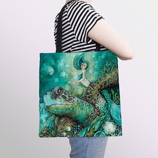 Woman with mermaid and sea turtle bag